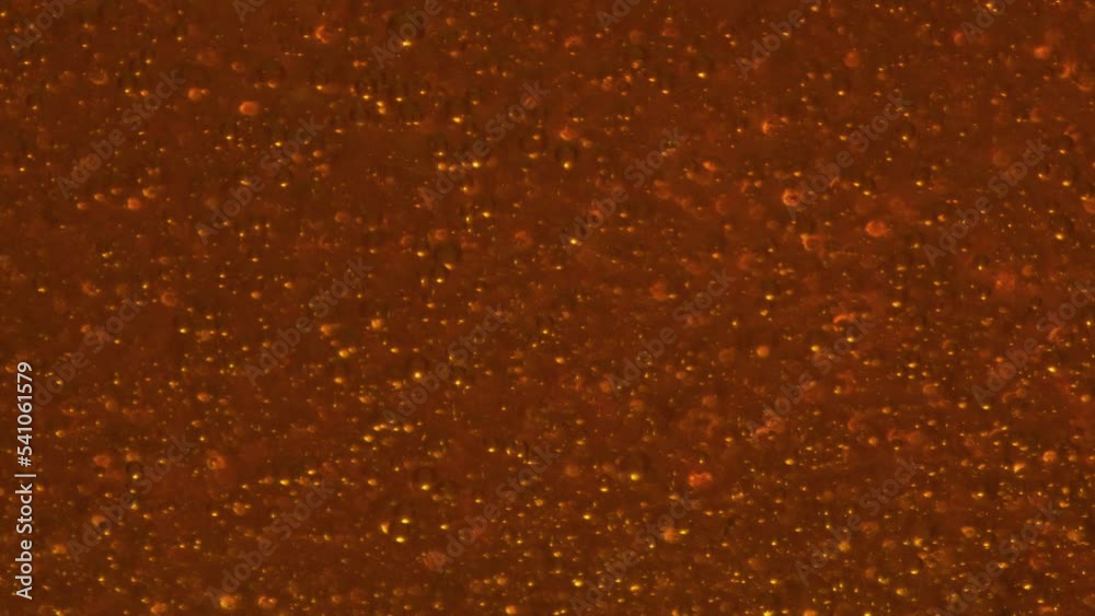 Carbon dioxide bubbles moving inside glass closeup. Fizzy cold alcohol beverage Carbon dioxide bubbles moving inside glass closeup. Fizzy cold alcohol beverage