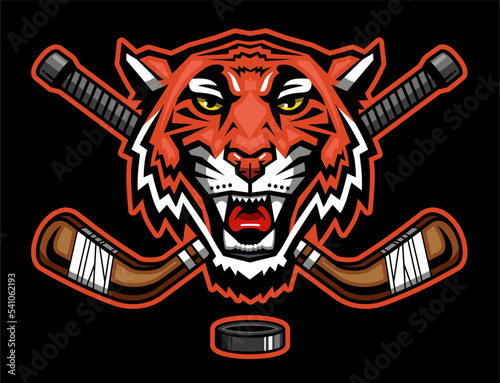 tiger mascot head with crossed hockey sticks for school, college or league sports