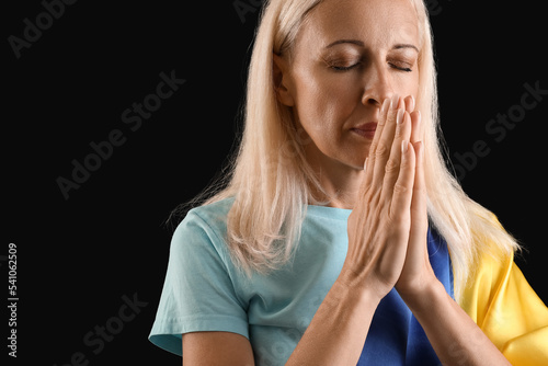 Mature woman with flag of U...