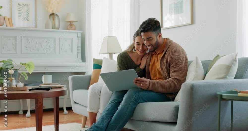 Laptop, living room and couple search website information for home investment, loan or real estate property discussion on sofa. Young people on couch with pc internet, planning future together