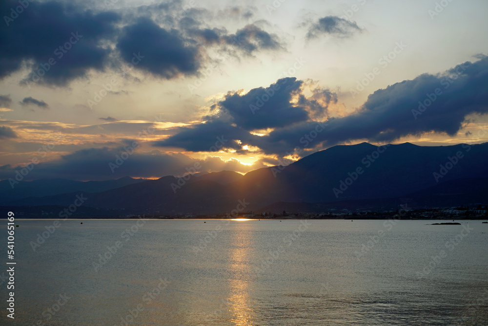 Sunrise behind the mountains over the Aegean Sea. October morning. The magic of nature Sunrise behind the mountains over the Aegean Sea. October morning. The magic of nature