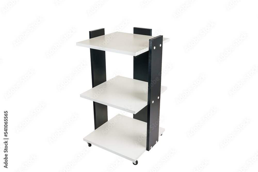 Cabinet or shelving unit on wheels with shelves on a white isolated background. Combined black with white chipboard. Cabinet or shelving unit on wheels with shelves on a white isolated background. Combined black with white chipboard.