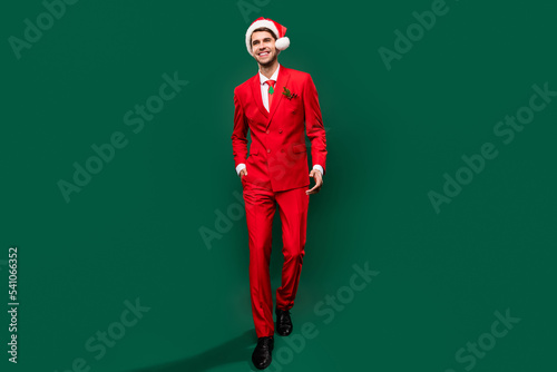 Full length body size view of attractive classy chic cool cheerful guy going isolated over green color background