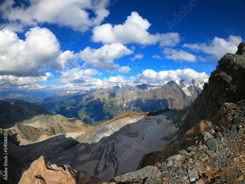 Majestic alpine landscape view of Üssers Barrhorn, Weisshorn and Bishorn covered by Brunegg glaciers in Swiss Alps, Wallis, Switzerland