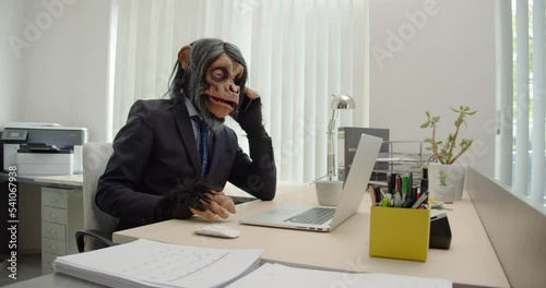 Monkey Businessman in Office talking on phone