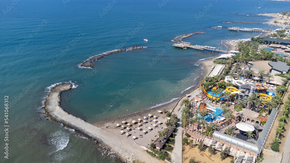 Aerial drone photo of the beautiful town of Alanya, a resort town on Turkey’s central Mediterranean coast showing a hotel and vacation holiday resort from above in the summer time.