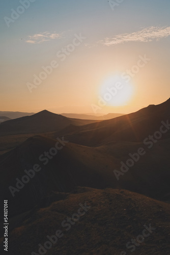 Beautiful sunset high in the mountains. Panoramic landscape of mountains.
