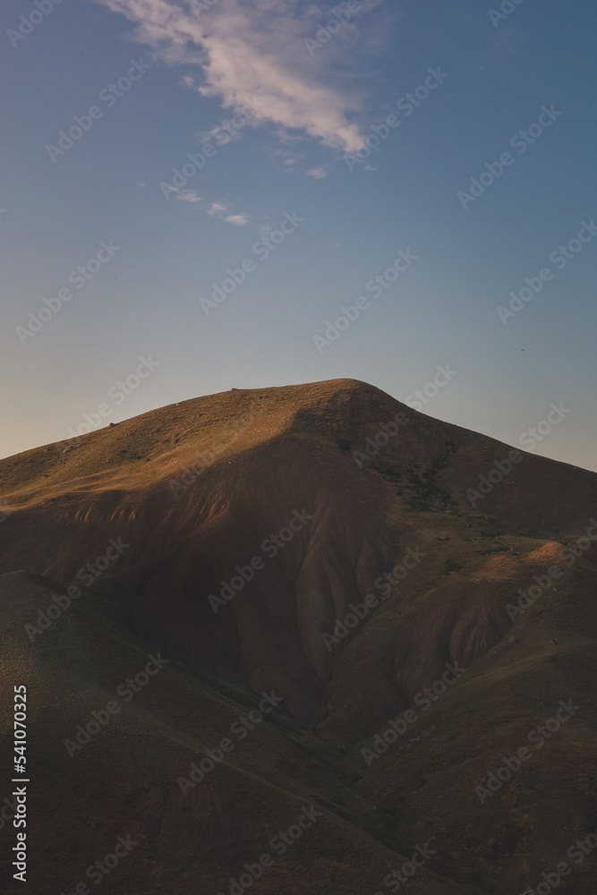 Beautiful sunset high in the mountains. Panoramic landscape of mountains.