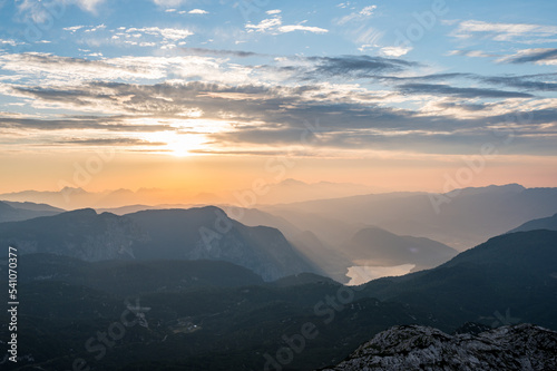 Spectacular sunrise with sun rising above lake Bled as seen from the mountains. © anzebizjan