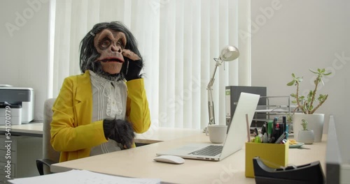 Monkey Business Woman in Office talking on phone