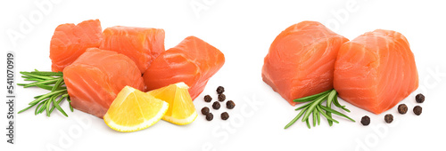 raw salmon piece cube with rosemary, lemon and peppercorn isolated on white background close up