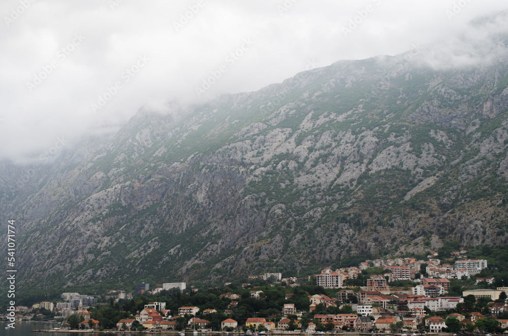 Beautiful panorama of Kotor in mountains and morning clouds, stock photo