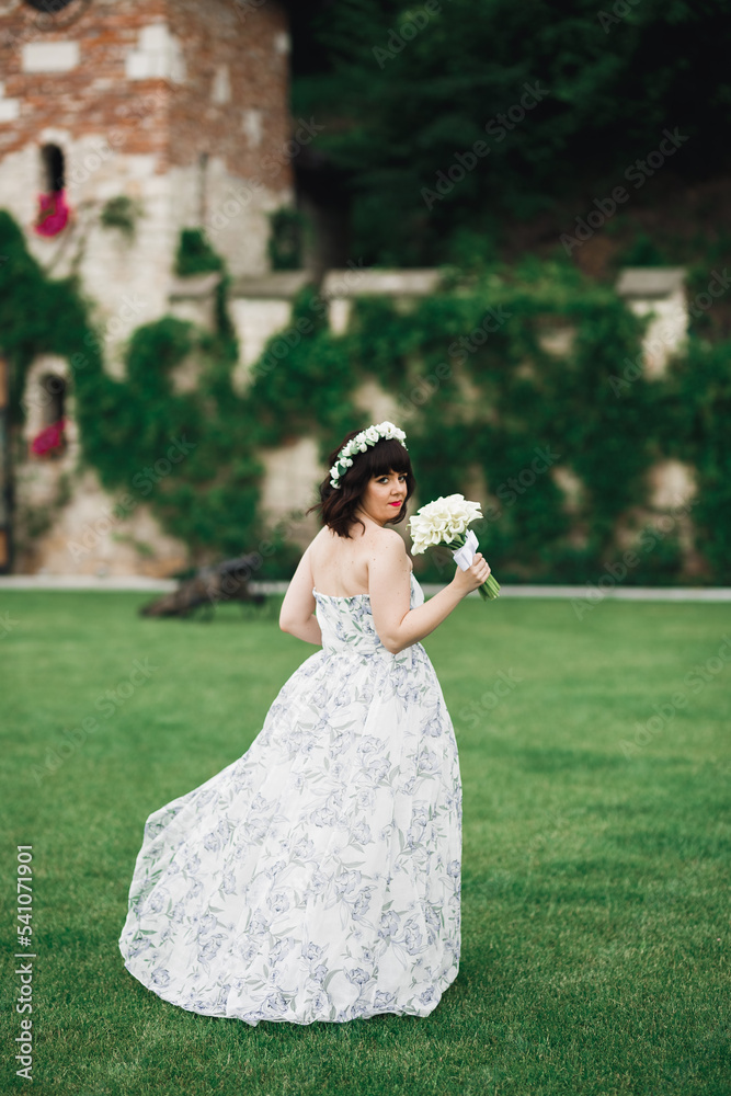 Portrait of stunning bride with long hair posing with great bouquet Portrait of stunning bride with long hair posing with great bouquet