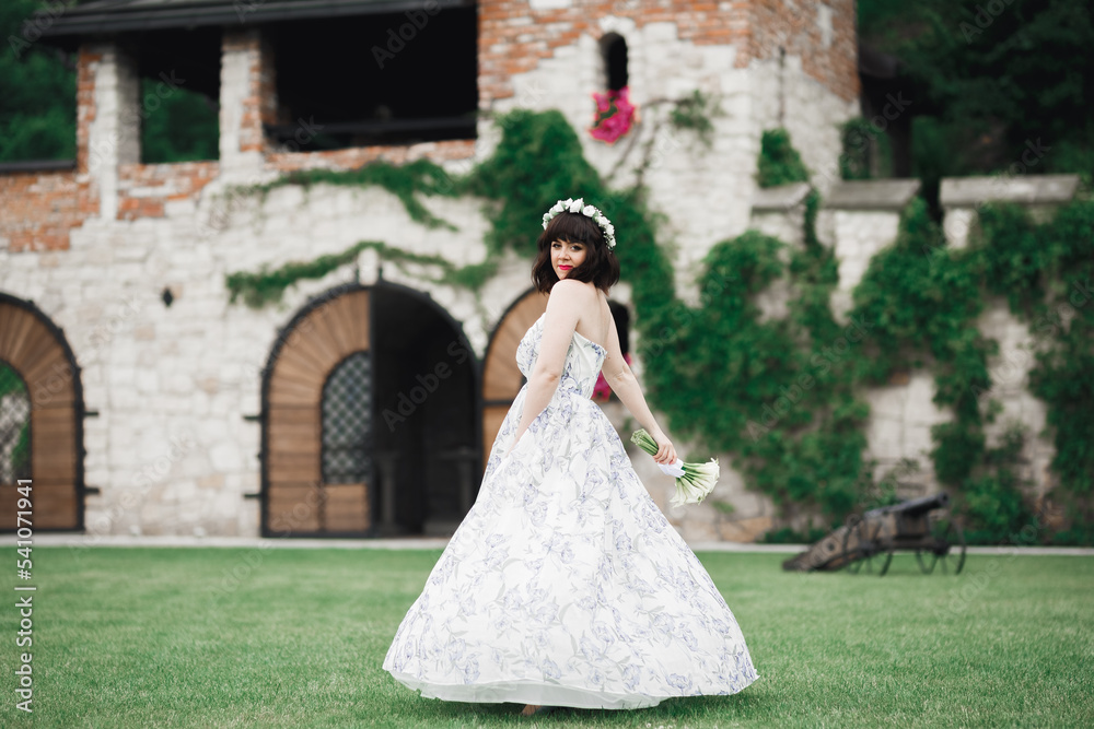 Portrait of stunning bride with long hair posing with great bouquet Portrait of stunning bride with long hair posing with great bouquet