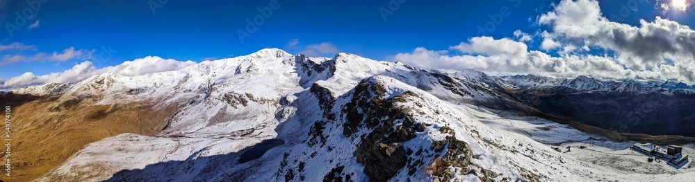 Large Panorama picture from Pischa Davos. Mountain pischa above davos klosters. Freshly snowed peak. High quality photo. High quality photo