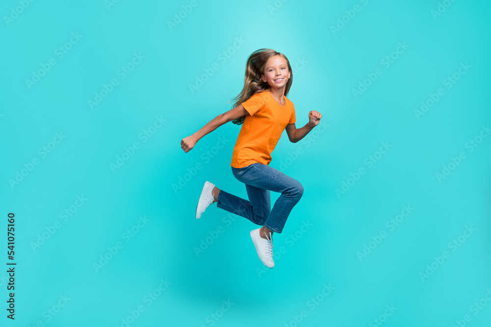 Full body length photo of young cute pretty schoolgirl running hurry late for school shopping sale season isolated on aquamarine color background Full body length photo of young cute pretty schoolgirl running hurry late for school shopping sale season isolated on aquamarine color background