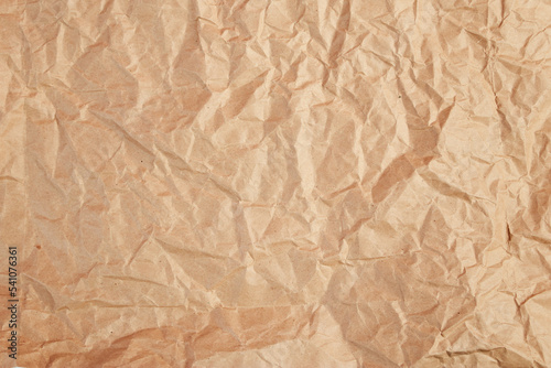 Background from crumpled craft paper for packaging.