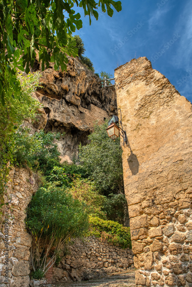 Travel destination, small old village in hear of Provence Cotignac with famous cliffs with cave dwellings and troglodytes houses, Var, Provence Alpes Cote D'Azur, France Travel destination, small old village in hear of Provence Cotignac with famous cliffs with cave dwellings and troglodytes houses, Var, Provence Alpes Cote D'Azur, France