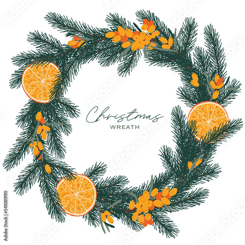 Christmas wreath with orange, sea buckthorn and spruce. 