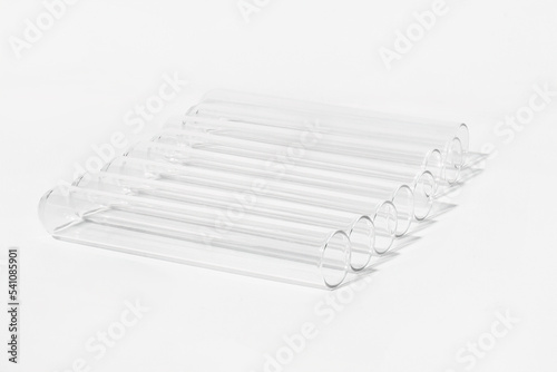 Transparent glass test tubes on a white background  laboratory  medical equipment  glass  chemistry  biochemistry  chemical laboratory  template  for medicine  for drug advertising  tests  medical ana