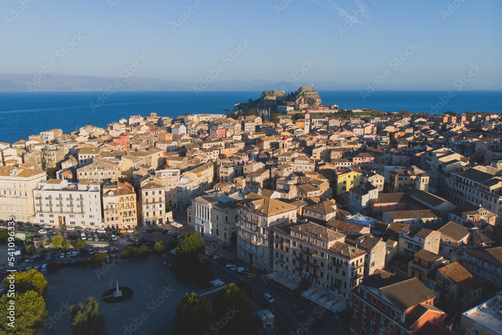 Kerkyra city, Corfu island, Greece, beautiful summer aerial drone view of Kerkyra old town center, with Ionean sea harbour port, Saint Spyridon Church, the Royal Palace and scenery beyond the city