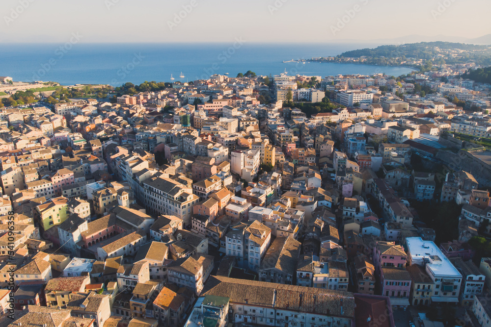 Obraz premium Kerkyra city, Corfu island, Greece, beautiful summer aerial drone view of Kerkyra old town center, with Ionean sea harbour port, Saint Spyridon Church, the Royal Palace and scenery beyond the city