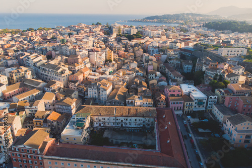 Kerkyra city, Corfu island, Greece, beautiful summer aerial drone view of Kerkyra old town center, with Ionean sea harbour port, Saint Spyridon Church, the Royal Palace and scenery beyond the city