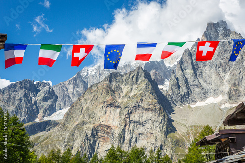 Obraz na płótnie European flags along tour du Mont Blanc, French Alps, near Switzerland and Italy w salonie