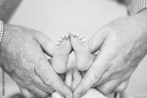 Holding baby feet with love