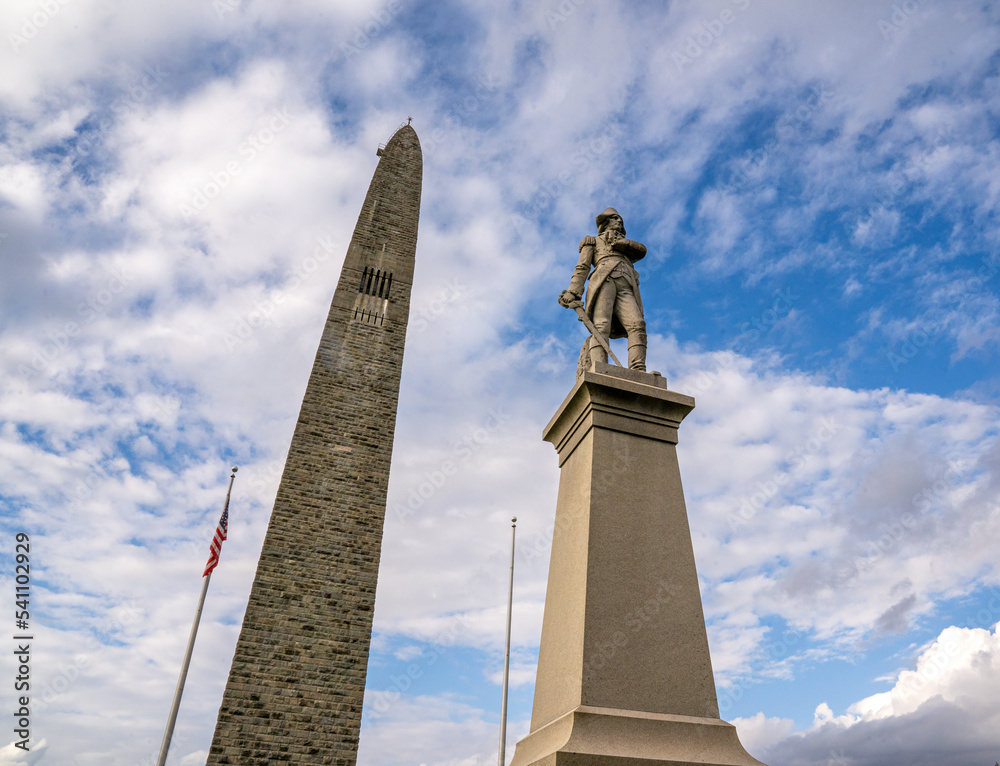 Bennington, VT - USA - Oct 10, 2022 View of the Statue of Seth Warner in front of Bennington Battle Monument. The monument commemorates the Battle of Bennington during the American Revolutionary War.