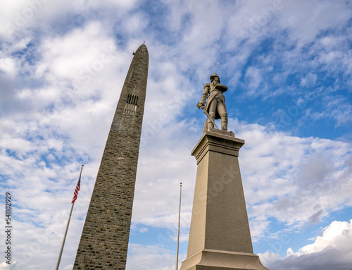 Obraz na płótnie Bennington, VT - USA - Oct 10, 2022 View of the Statue of Seth Warner in front of Bennington Battle Monument. The monument commemorates the Battle of Bennington during the American Revolutionary War. w salonie
