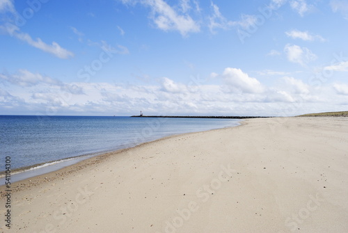 Horizon landscape of beach with calm ocean water, jetty, no people. Scusset Beach State Reservation October 2022.