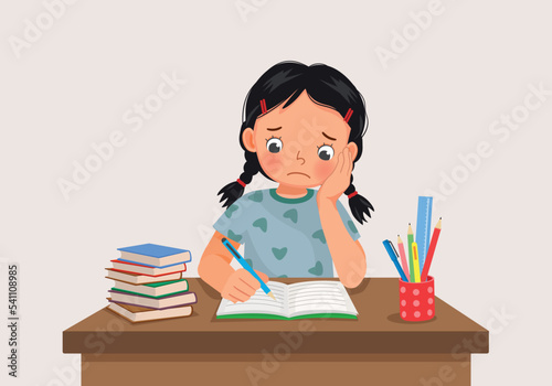 cute little girl feeling stress tired and bored studying doing homework on the desk