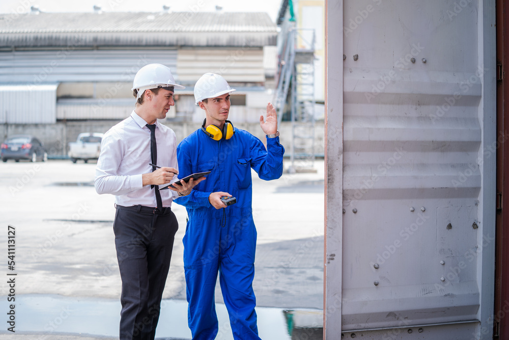 Foreman man and worker working checking at Container cargo,Logistics import export shipping concept. Foreman man and worker working checking at Container cargo,Logistics import export shipping concept.