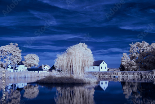 infrared photography - ir photo of landscape under sky with clouds - the art of our world in the infrared spectrum
