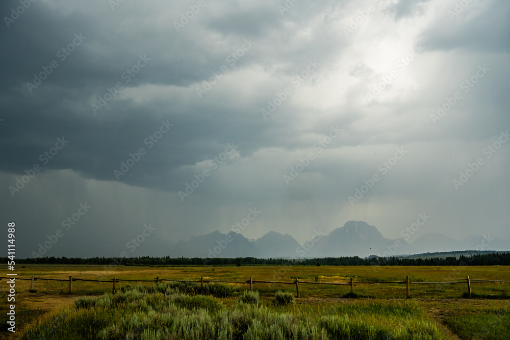 Summer Storm Obscures The Grand Tetons Across The Valley
