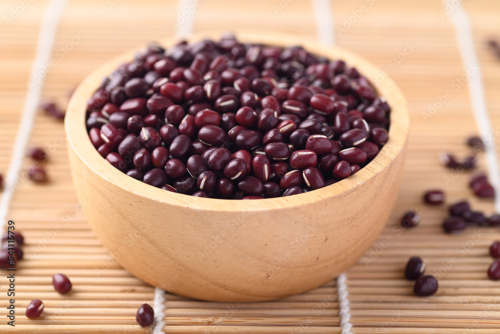 Azuki beans, Adzuki bean or red mung beans in wooden bowl, Food ingredients in many Chinese dishes and filling in Japanese sweet Azuki beans, Adzuki bean or red mung beans in wooden bowl, Food ingredients in many Chinese dishes and filling in Japanese sweet