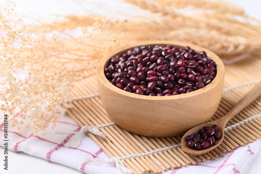 Azuki beans, Adzuki bean or red mung beans in wooden bowl, Food ingredients in many Chinese dishes and filling in Japanese sweet Azuki beans, Adzuki bean or red mung beans in wooden bowl, Food ingredients in many Chinese dishes and filling in Japanese sweet