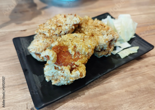 Japanese food. Karaage Japanese Fried Chicken thigh dusted with flour and deep-fried in hot oil. With tender and juicy .