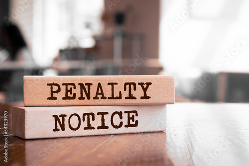 Wooden blocks with words 'Penalty Notice'. photo