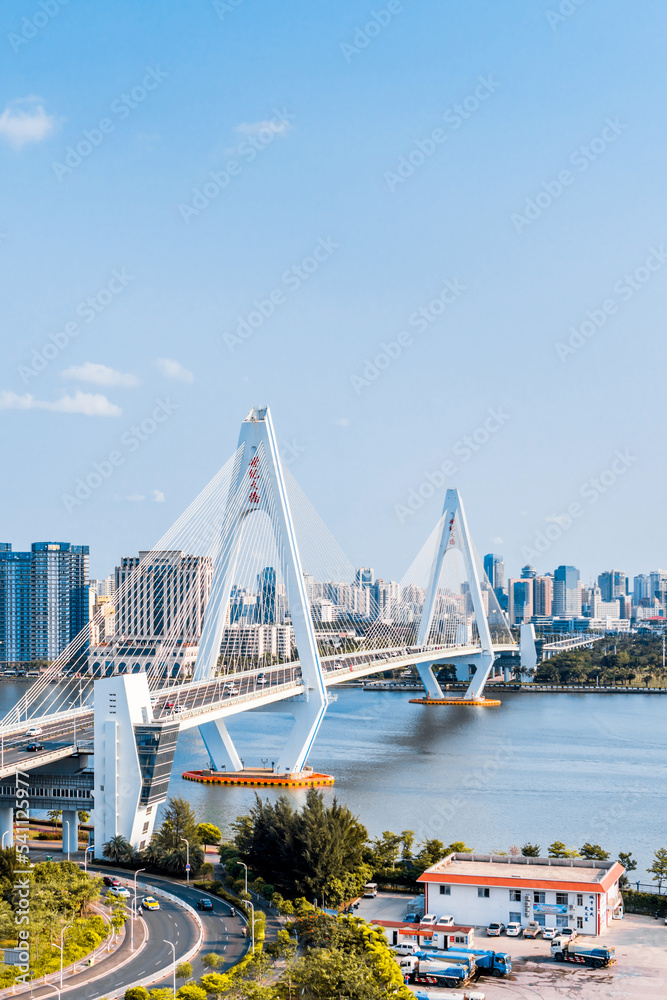 Naklejka premium High view sunny day scenery of Century Bridge on Haidian River, Haikou, Hainan, China