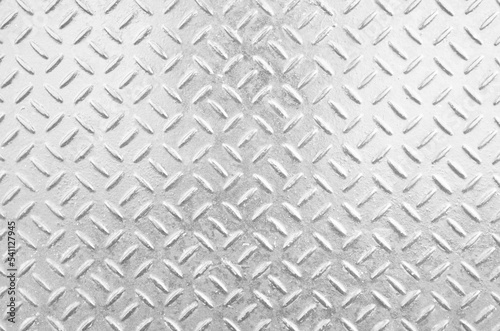 Silver metal plate with embossed pattern for anti slip. Glossy silver grunge metallic textured background.