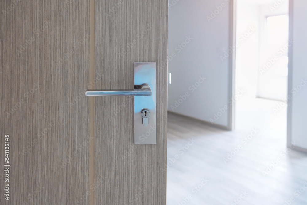 Closeup doorknob of wooden door between open or close the door Closeup doorknob of wooden door between open or close the door