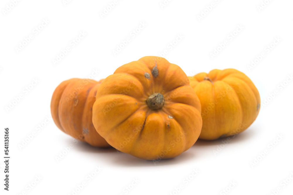 Fototapeta premium closeup of small pumpkins on white background