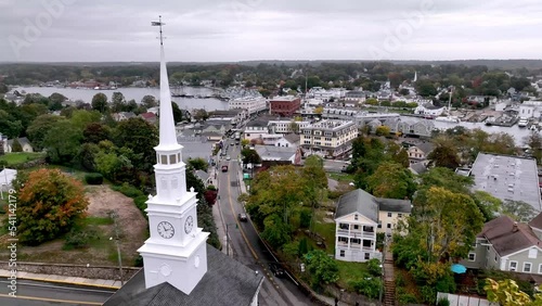 aerial over fall leaves and church in mystic connecticut