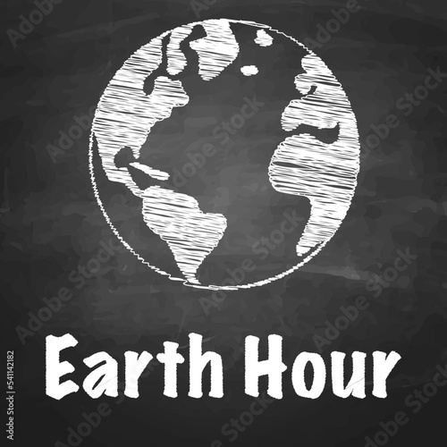 earth hand-drawn with chalk on a blackboard with the inscription "earth hour"