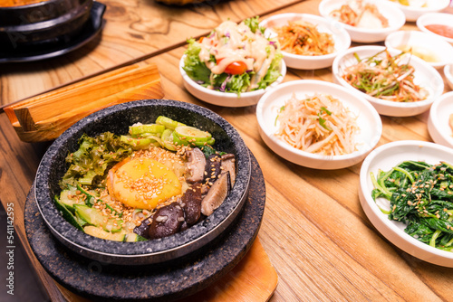Korean traditional dish- bibimbap mixed rice with vegetables Include beef and fried egg and pickles set