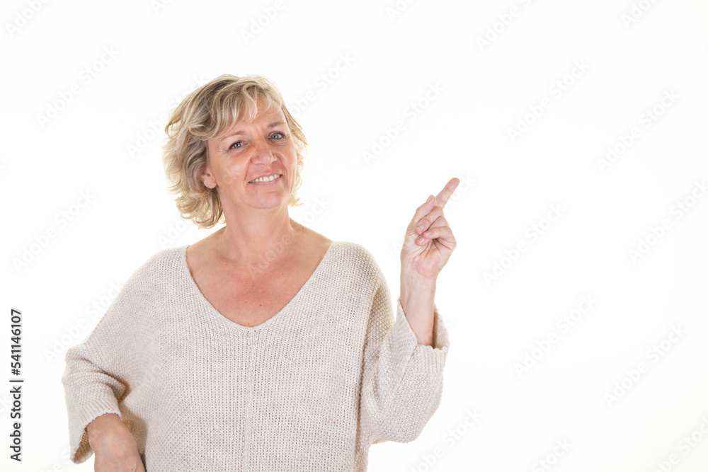 pretty business woman beautiful senior blonde over isolated white background pointing finger mature to side copy space pretty business woman beautiful senior blonde over isolated white background pointing finger mature to side copy space