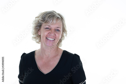 blonde casual senior mature woman portrait smiling and happy looks aside copy space