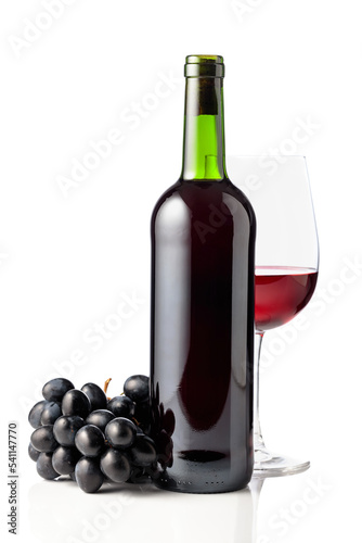 Red wine and blue grapes are isolated on white.